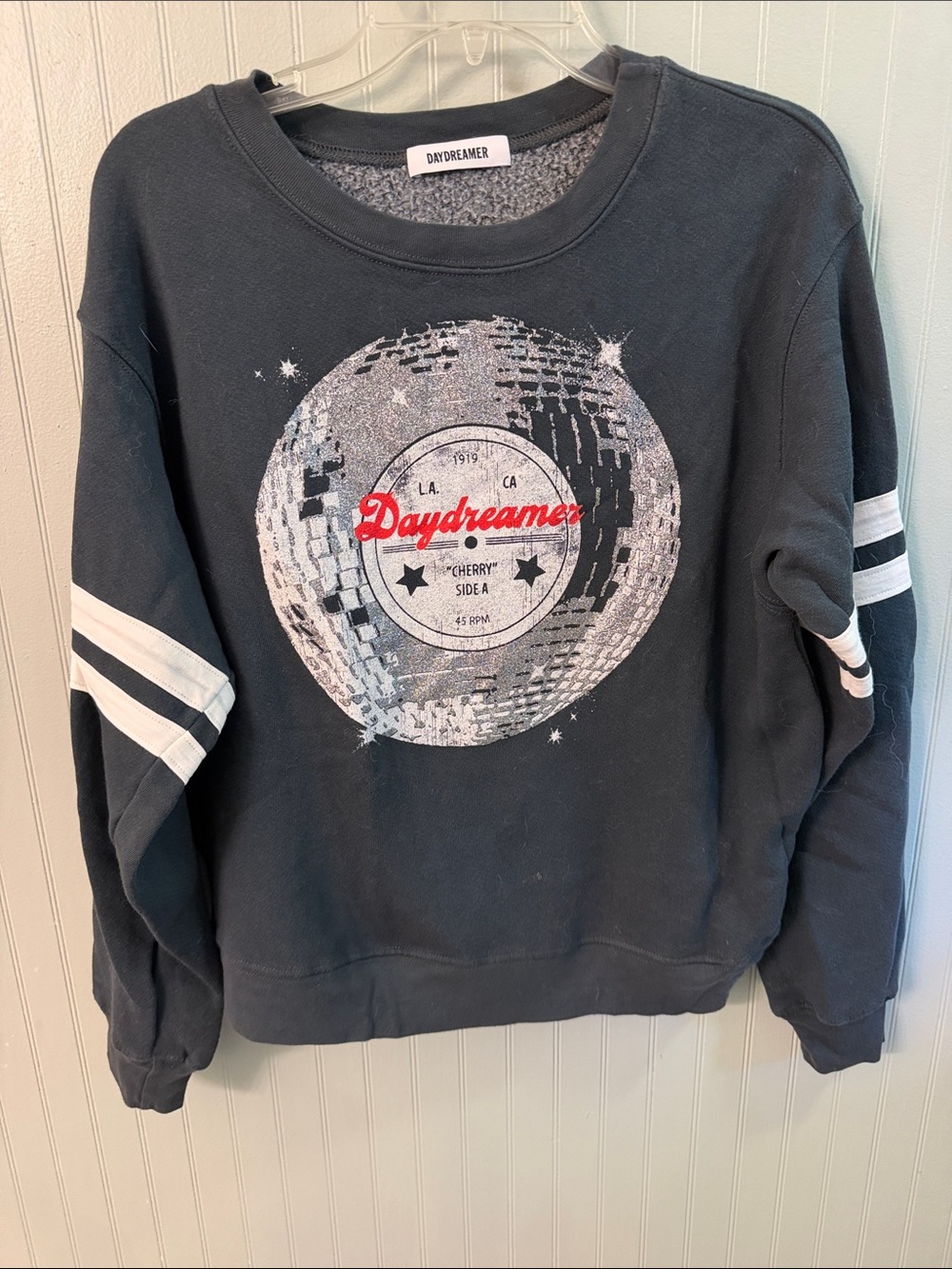 Daydreamer Black Sweatshirt with Red Logo and White Sleeve Stripes